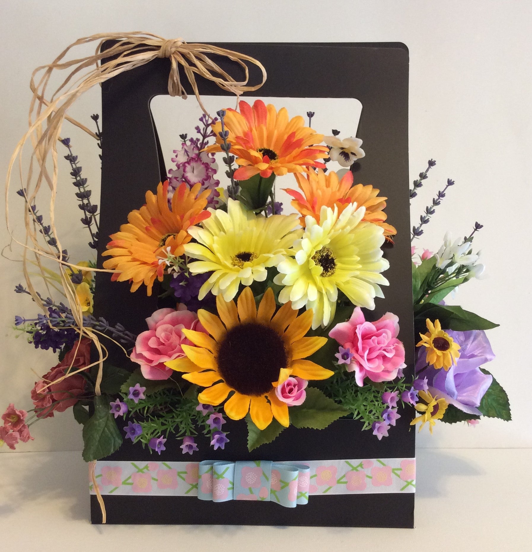 Silk Flowers in Black Bag